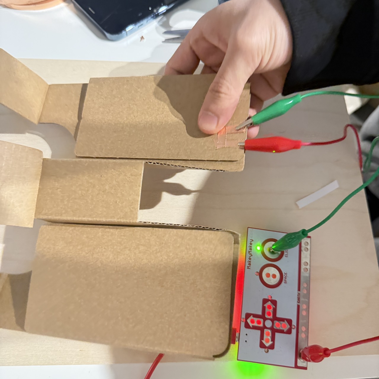 Human testing helps confirm each pad's responsiveness and identifies the ideal pressure zone. A remaining unknown is whether users will need additional visual indicators to understand where the dog should step.